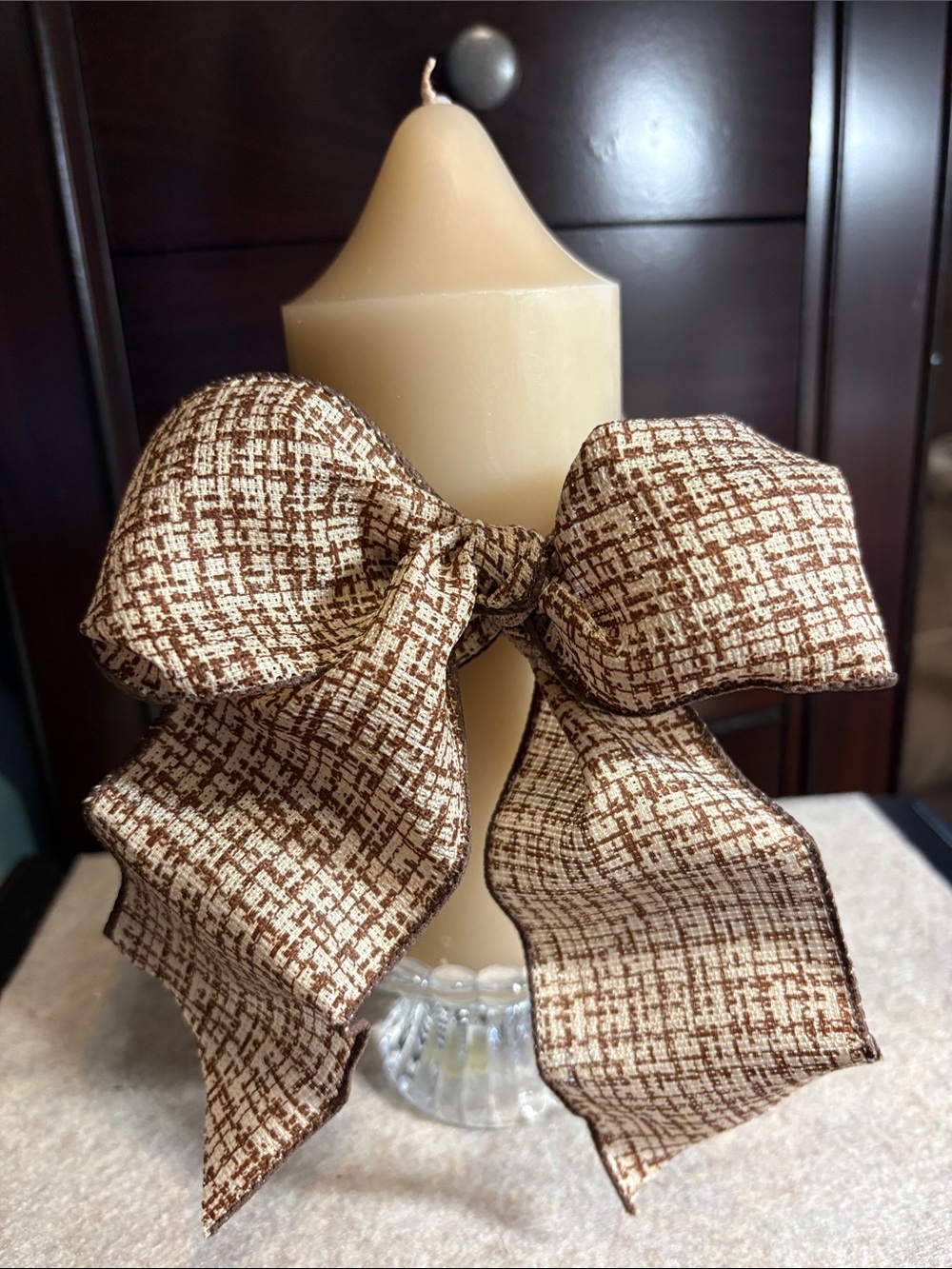 Brown Patterned Bow on Party-Lite candle and Party-Lite candle Stand
